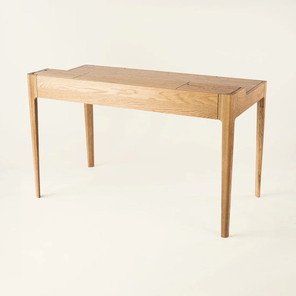 Smart Office Desk with built-in storage compartments and device slots in a modern workspace setting